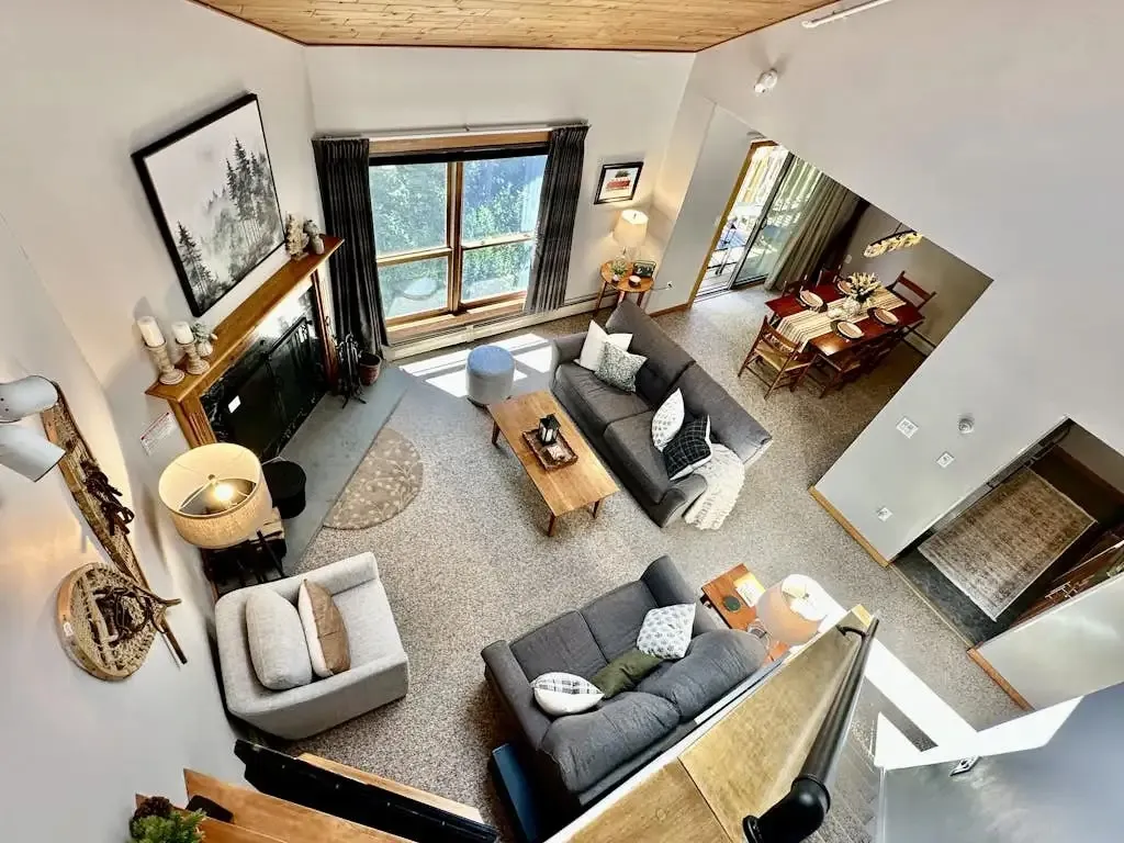 Overhead view from the loft down into the open living and dining area below